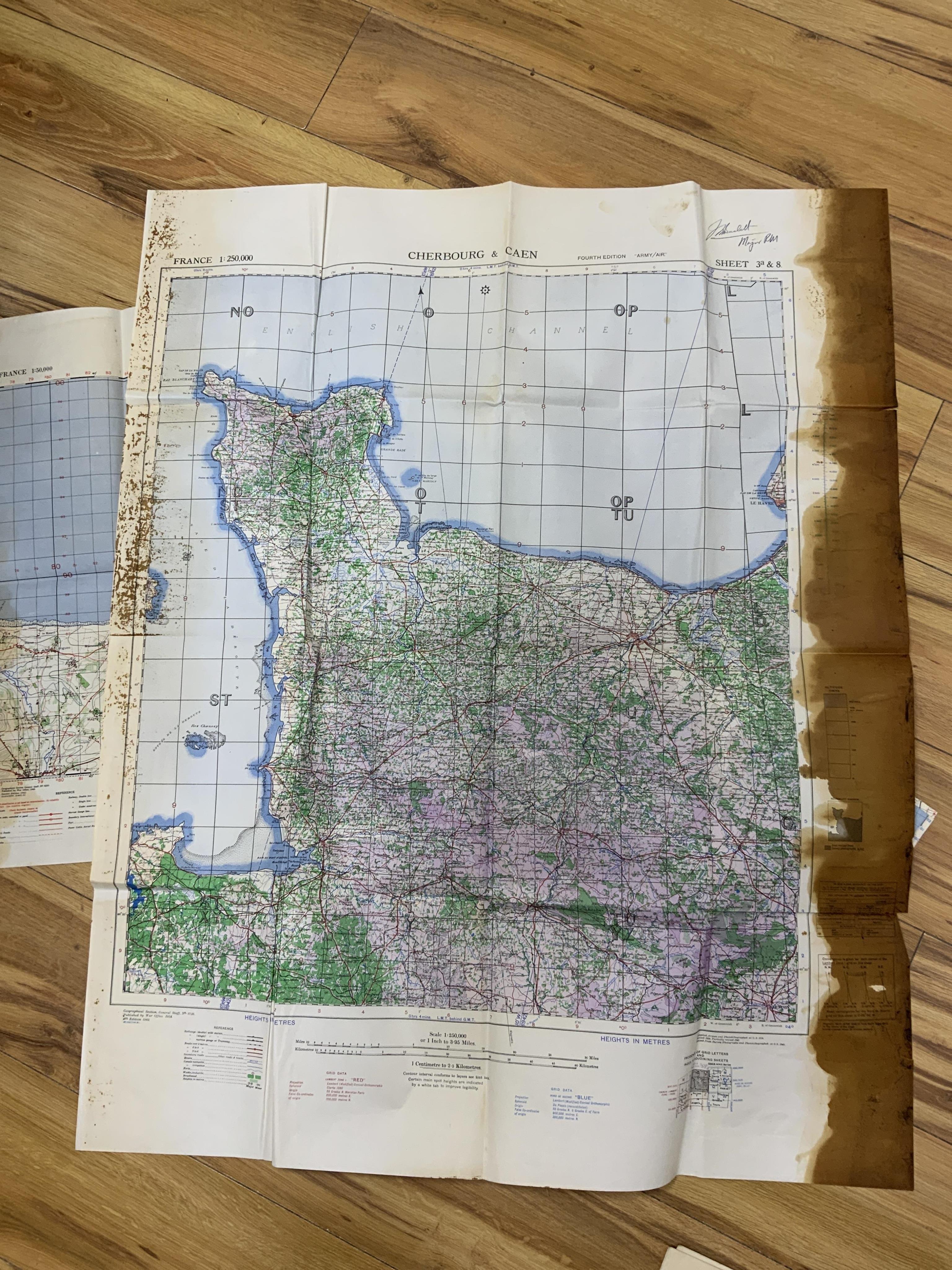 WWII D-Day and Operation Neptune related interest; an archive of mainly naval documents, maps and photographs relating to the invasion of Juno beach, 6 June 1944, comprising; the personal papers, maps, and other document